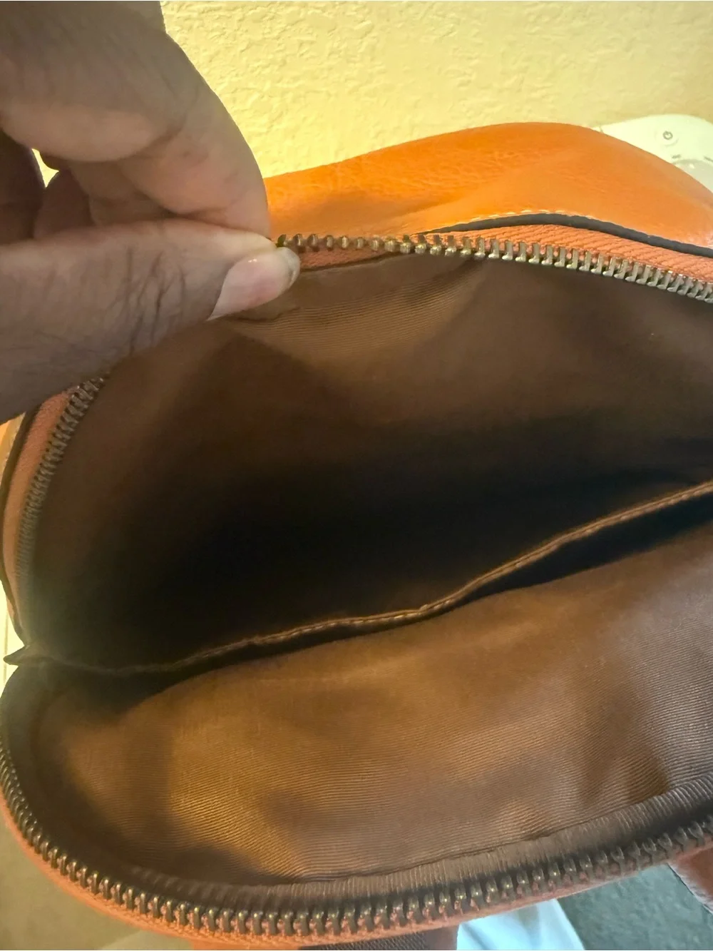 COACH Orange Pebbled Leather Men's Backpack with Front Logo Pocket